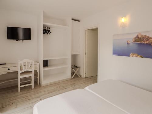 a white bedroom with a bed and a desk at Sun Club El Dorado - All Inclusive in Llucmajor