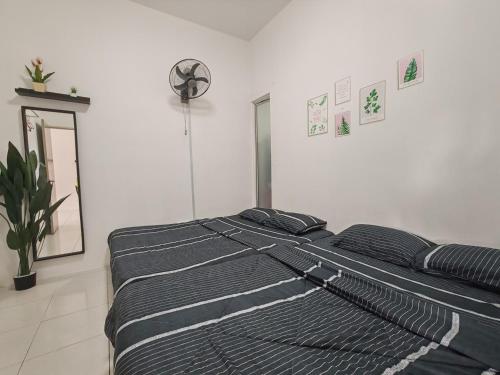 Postel nebo postele na pokoji v ubytování ZE VI Homestay,Tanah Rata
