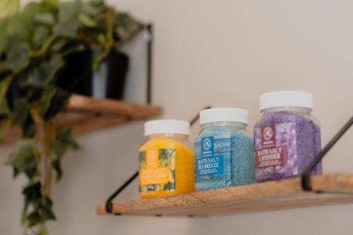 three bottles of vitamins sitting on a shelf at DimorAmare in Bari