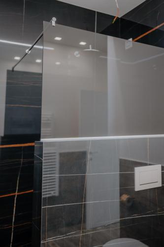 a glass shower in a bathroom with a toilet at DimorAmare in Bari