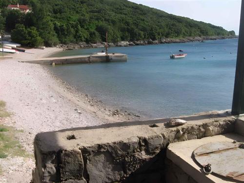 a view of a beach with a boat in the water at Holiday home in Stivan - Insel Cres 13654 in Štivan
