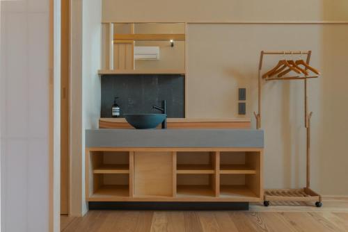 a bathroom with a counter with a sink at NEW2025! Shirakaba ROKUI 白樺 緑居 Architect-designed Luxury Villa with Concierge Service in Osaka
