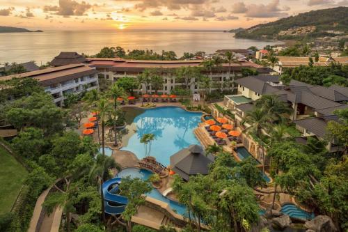 an aerial view of a resort with a swimming pool at Diamond Cliff Resort & Spa, Patong Beach in Patong Beach
