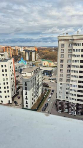 a view of a city with tall buildings and cars at Двокімнатний люкс в ЖК над Бугом in Khmelʼnytsʼkyy