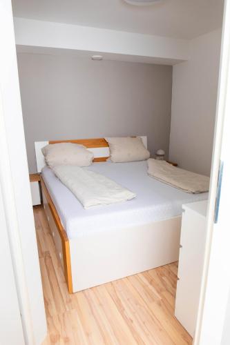 a bedroom with a bed in a small room at Ferienwohnung Herta in Breitenbach am Inn