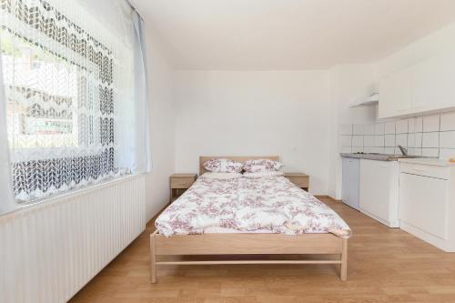Postel nebo postele na pokoji v ubytování Apartmaji Trstenjak