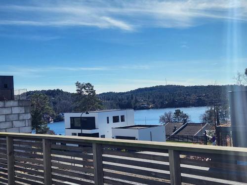 a view of a lake from a balcony at Modern leilighet med fin utsikt fra terrassen in Lillesand