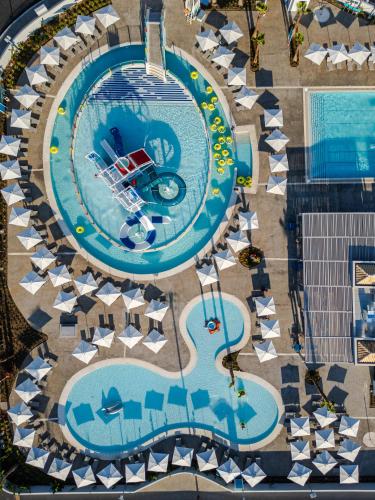 an overhead view of a pool at a resort at Blue Lagoon Queen in Kalyves Poligirou
