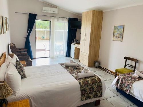 Ένα ή περισσότερα κρεβάτια σε δωμάτιο στο Die Kleipot Guest House