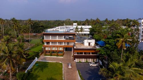 an aerial view of a house with palm trees at West Bay MARISOL in Varkala