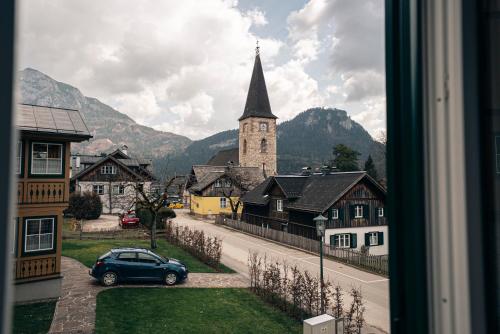 a view from a window of a town with a church at SIEGLGUT in Altaussee