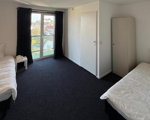 Voodi või voodid majutusasutuse Victor hotel toas