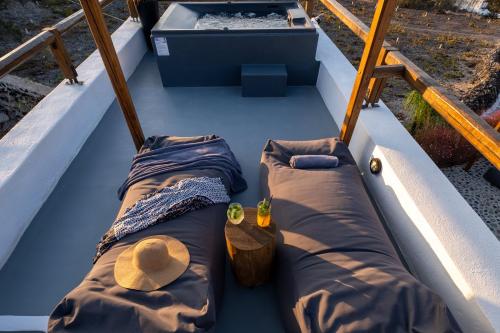 an overhead view of a boat with two beds at Noelia Suites in Oia