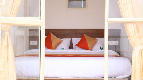 Postel nebo postele na pokoji v ubytování CJ Clamping Resort Munnar