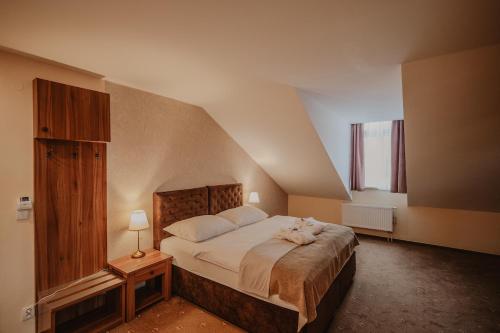 Postel nebo postele na pokoji v ubytování Hotel Solisko