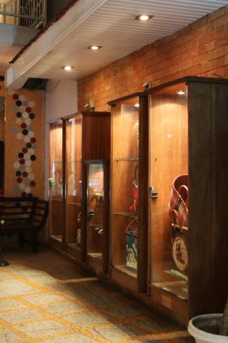 a row of wooden lockers in a room at Hotel Brajas in Antananarivo