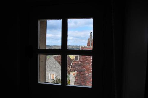 a view from an open window of a building at Les Glycines Vézelay in Vézelay
