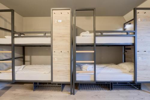 a group of bunk beds in a room at a&o Rotterdam City in Rotterdam