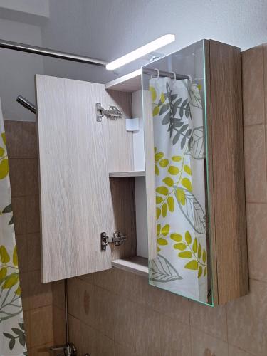 a bathroom with a shower with a glass door at Olive Tree Apartment in Asprovalta