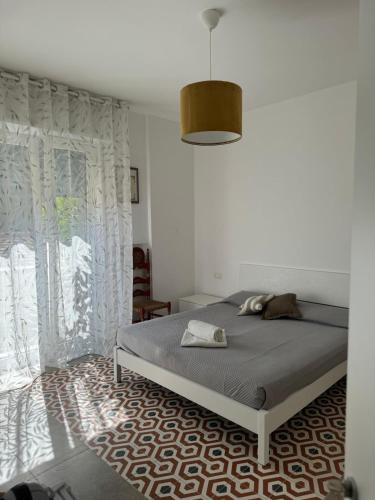 Ένα ή περισσότερα κρεβάτια σε δωμάτιο στο Le Suites di Teodoro