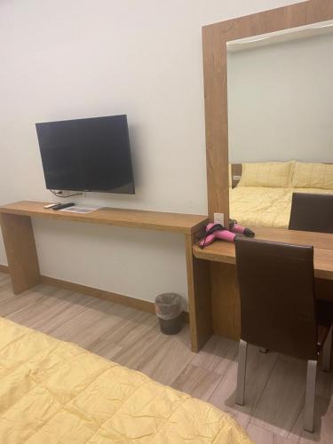 TV a/nebo společenská místnost v ubytování Shun Cheng Hotel