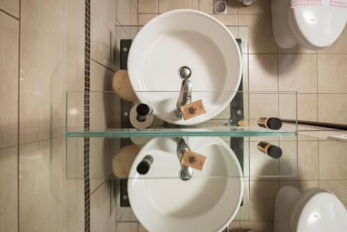 a bathroom with a sink and a mirror at Areti Suites in Kathiana