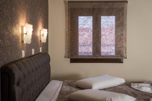 a living room with a couch and a window at Areti Suites in Kathiana