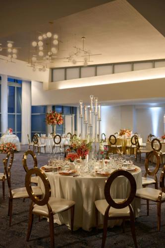 a dining room with a long table and chairs at Baltimore Marriott Waterfront in Baltimore
