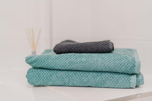 a stack of towels sitting on a shelf at Marina Palace with Swimming Pool in Adeje
