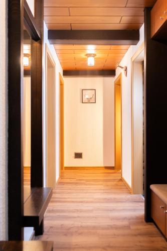 a hallway in a building with wooden ceilings at homy MontaVista - 300m zur Golmerbahn in Vandans