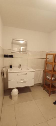 a bathroom with a sink and a toilet and a mirror at Appartements an der Kaiserpfalz - Königshof in Forchheim