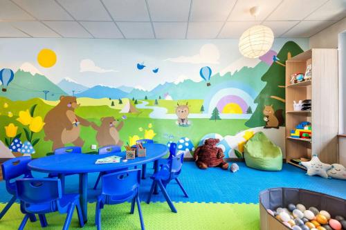 a childrens room with a mural of animals on the wall at Four Points by Sheraton Bansko in Bansko