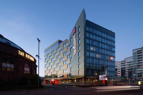 a tall building with a sign on the side of it at Radisson RED Hotel, Glasgow in Glasgow