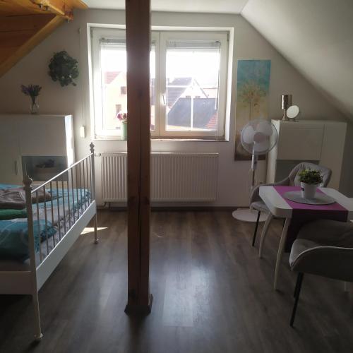 a small room with a crib and a window at Magical apartment Dobříš in Dobříš