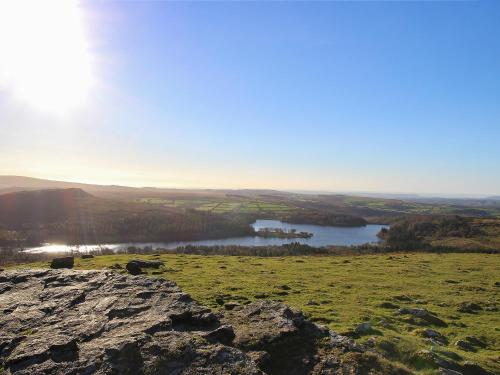 a view from the top of a hill with a lake at Southlake Barn in Dousland