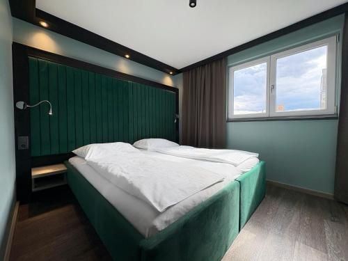 Postel nebo postele na pokoji v ubytování ampm Hotel Schönbrunn