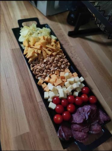 a tray of different types of food on a table at Un moment pour nous EI in Bruay-sur-lʼEscaut