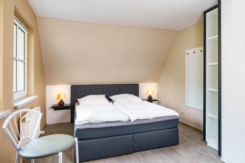 Ένα ή περισσότερα κρεβάτια σε δωμάτιο στο Ferienhaus CARPE DIEM in Gager WE 03 direkt am Bodden