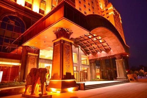 a statue of an elephant in front of a building at Kaixuanmen Hotel Shijiazhuang Yiling Health Center in Shijiazhuang