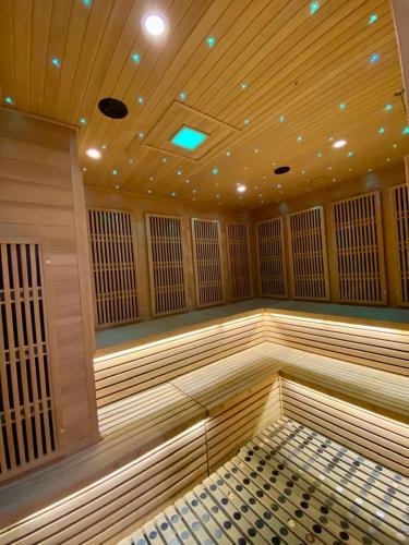 a large empty sauna with a wooden ceiling at K avenue B3A 2bed studio room in Donggongon