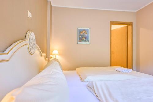 Postel nebo postele na pokoji v ubytování Hotel Bodeblick