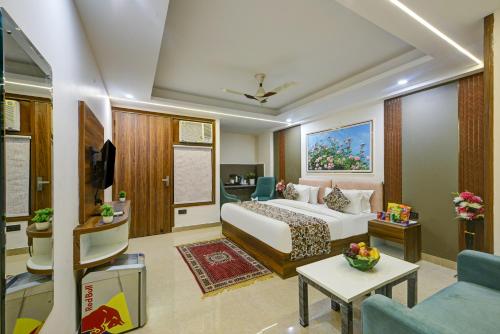 a hotel room with a bed and a living room at Hotel Dream World - Free Airport Drop in New Delhi