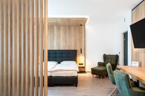 Posteľ alebo postele v izbe v ubytovaní City Hotel Stockerau