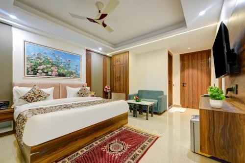 a hotel room with a bed and a tv at Hotel Dream World - Free Airport Drop in New Delhi