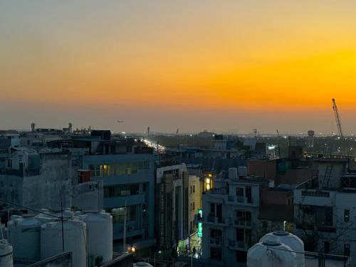 a view of a city at sunset at Hotel Dream World - Free Airport Drop in New Delhi