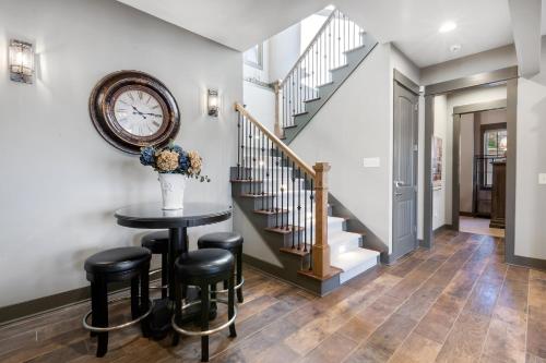 a dining room with a table and a clock on the wall at Lakefront Getaway Dock Fire Pit & Games in Seneca