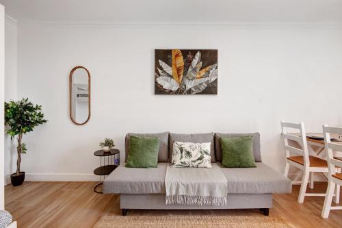 a living room with a couch and a table at Lovely And New Apartment In Oura in Albufeira