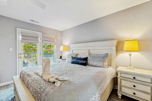 a bedroom with a large bed and a window at Creekside --- 26 Dockside Dr in Millville