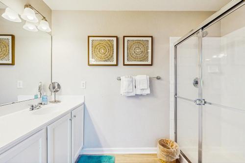 a bathroom with a shower and a sink at Creekside --- 26 Dockside Dr in Millville
