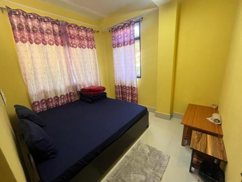 Katil atau katil-katil dalam bilik di Zumthang Homestay Tashiding1